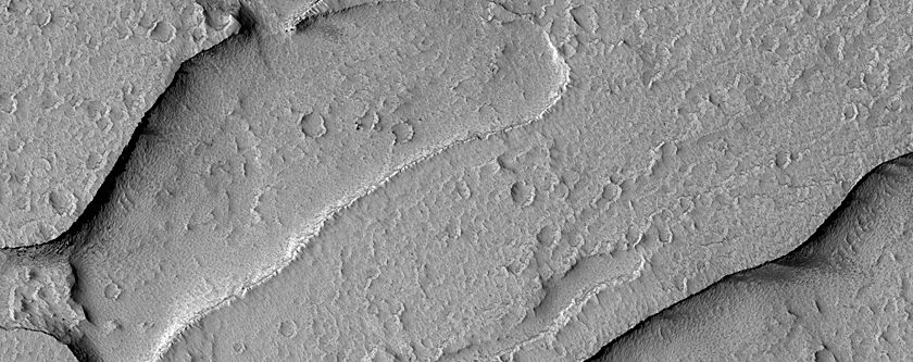 Channels or Flow Features with Inverted Topography on Arsia Mons