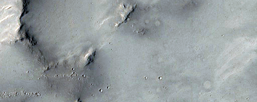Large Cluster of Small Craters Near Maadim Vallis