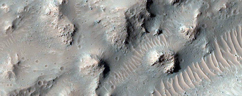 Central Uplift and Pitted and Ponded Material in Well-Preserved Crater