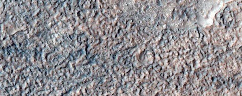 Degraded Crater with Valley and Light-Toned Units in Hellas Planitia