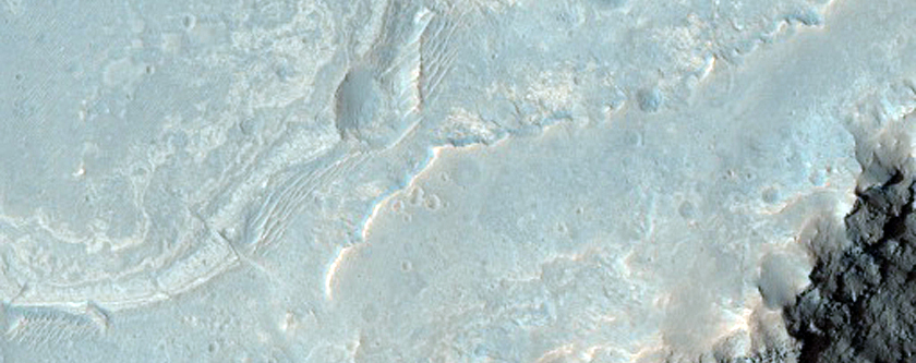 Light-Toned Layering along Plains Adjacent to Melas Chasma