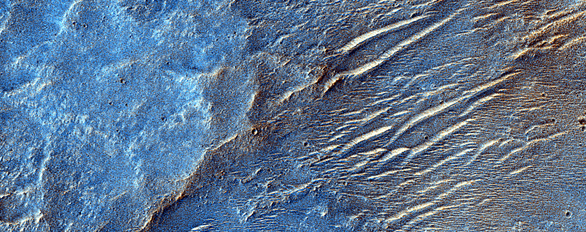 Multiple Phyllosilicate Exposures in Crater Wall Northwest of Hellas Planitia