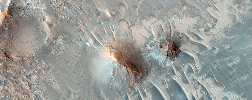 Bedrock Exposures in Central Uplift of Large Crater North of Eos Chasma
