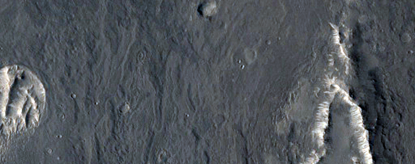 Teardrop-Shaped Outcrop around Impact Crater