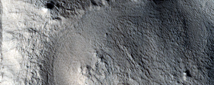 Channels in Rim of Crater within Cassini Crater