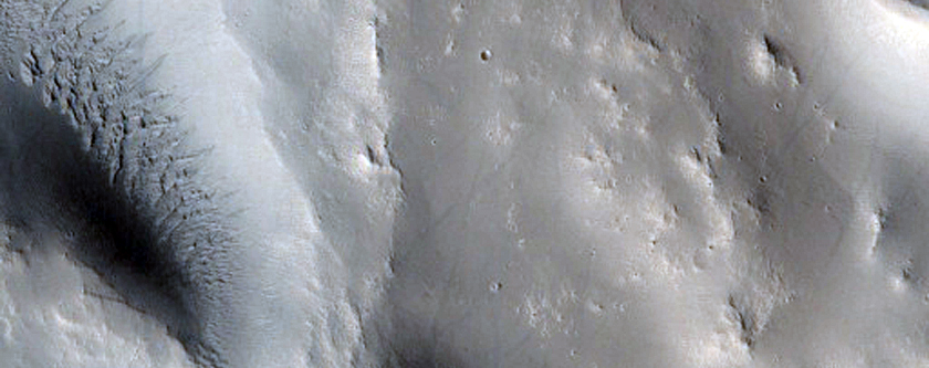 Ejecta Falling Into Earlier Large Crater