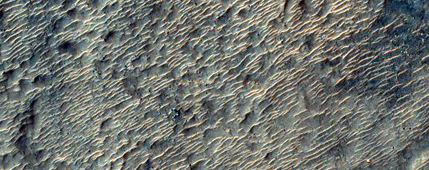 Layered or Flowing Terrain in Northern Hellas Basin