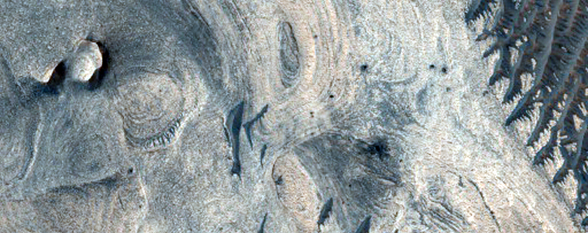 Differential Erosion of Light-Toned Stratigraphy in Melas Chasma