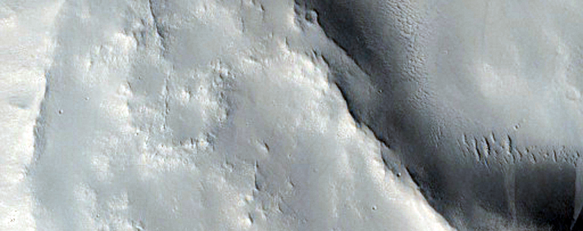 Ejecta Falling Into Earlier Large Crater