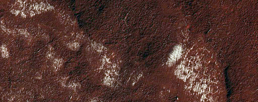 Circular Feature within South Polar Layered Terrain Scarp