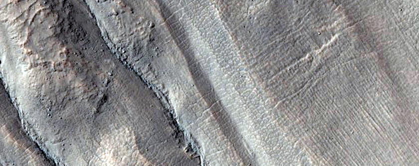 Gullies Facing Outward on Raised Crater Rim