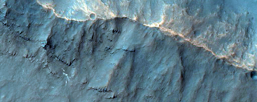 Crater with Light-Toned Ejecta in the Wall of a Larger Crater