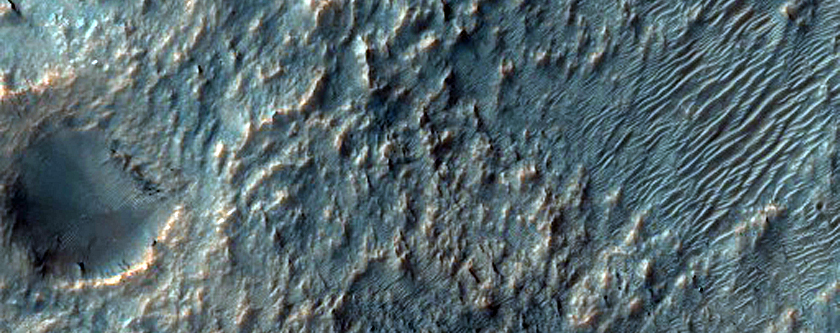 Crater with Possible Phyllosilicates in Ejecta Northwest of Hellas Planitia