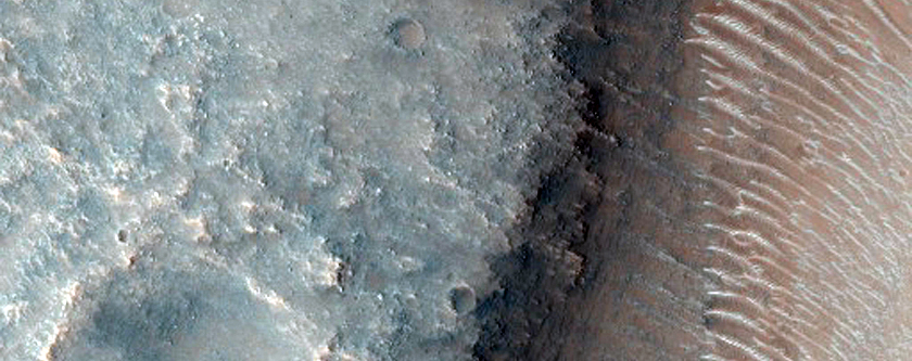 Possible Hydrated Layer on Scarp in Solis Planum