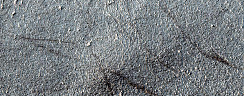 Degraded Crater Rim in Planum Chronium