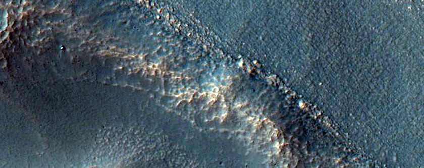 Crater with Tongue-Shaped Features on Walls