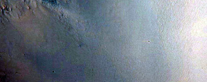 Possible Impact into Altered Bedrock Exposed within Libya Montes Massif