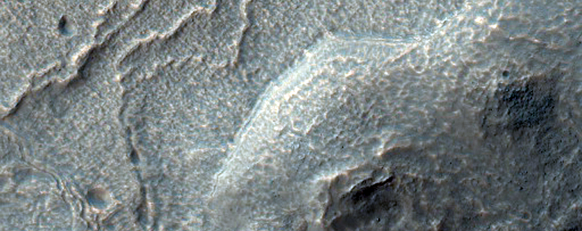 Material Mantling South Slope in MOC Images R11-03121 and S14-01956