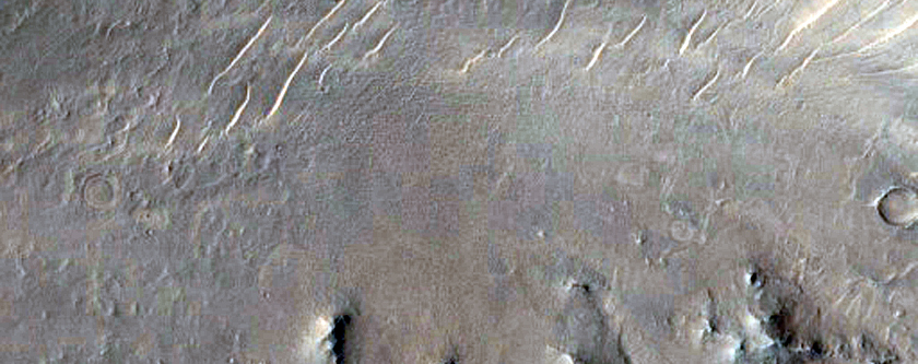 Well-Preserved 7-Kilometer Diameter Crater within Isidis Planitia