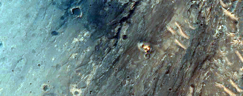 Light-Toned Material and Rough Terrain along Noctis Labyrinthus Pit