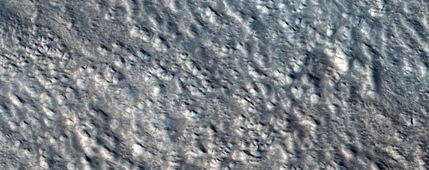 Crater Cluster Superimposed on Larger Crater on Alba Patera