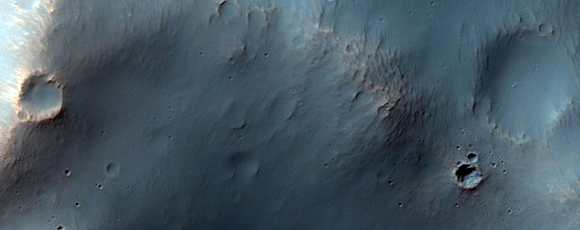 Bright Outcrops on Degraded Columbus Crater Rim