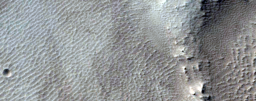 Well-Preserved Crater in Tharsis Region Lavas