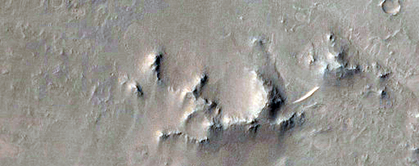 Well-Preserved 7-Kilometer Diameter Crater within Isidis Planitia