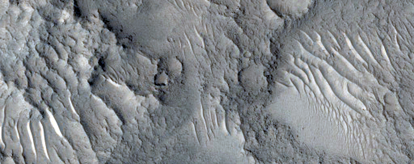Central Uplift and Layered Materials on Crater Floor