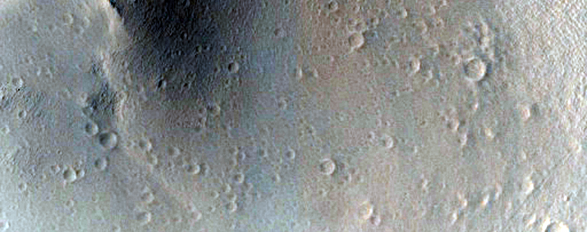 Material beyond Margins of Ridged Lobe Northwest of Olympus Mons