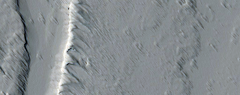 Source for a Sinuous Channel in Tharsis Montes