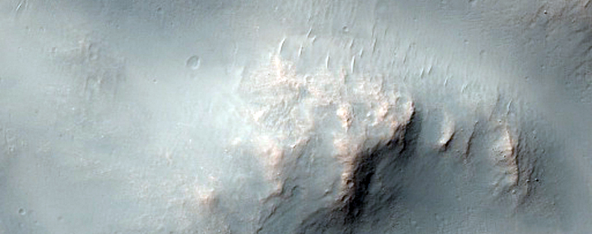 Distal Rampart of Layered Ejecta from a Fresh Crater