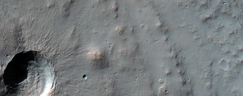 Small Crater Spanning Margin Fill Material in Larger Crater
