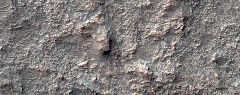 Layered Bedrock in Shallow Crater Northeast of Hellas Planitia