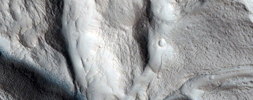 Layering in an Impact Crater on the North Flank of Alba Patera