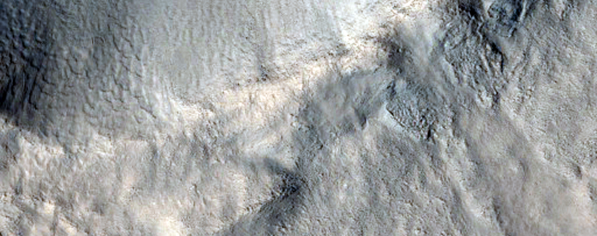 Crater with Sharp Rim and Elongated Secondaries