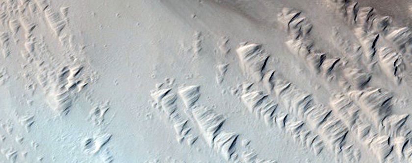 Crater with Wind Streak Northwest of Ascraeus Mons