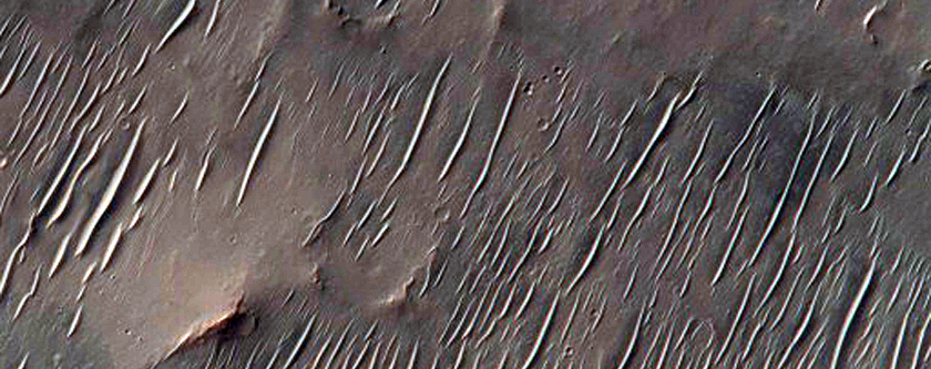 Crater Exposing Stratigraphy of Light-Toned Layered Bedrock