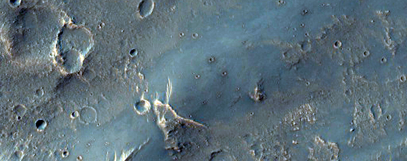 Ejecta Cut by Erosion in Sfax Crater along Edge of Ganges Chasma