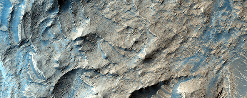 Light-Toned Material and Rough Terrain along Noctis Labyrinthus Pit