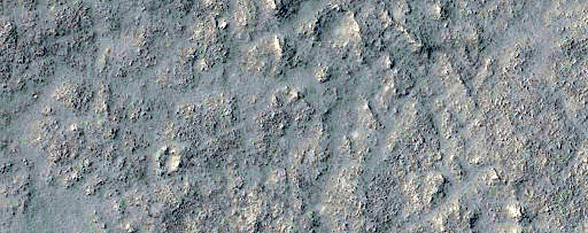 Layered Rocks on Floor of Large Ancient Crater
