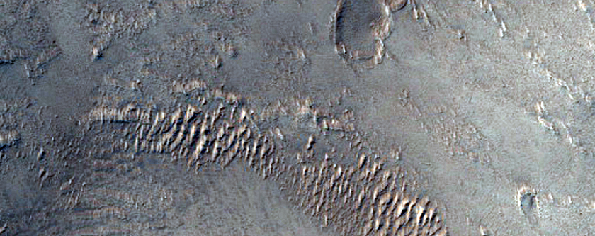 Hummocky and Collapsed Terrain Contact on Western Arsia Mons