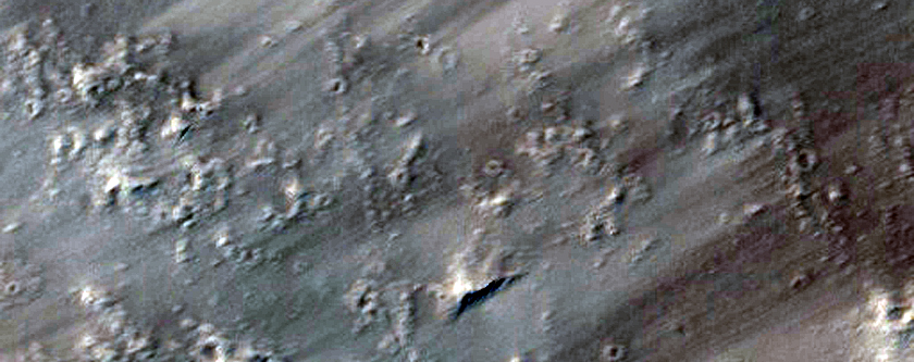 Small Cones in Older Lava Plains of Tharsis Region