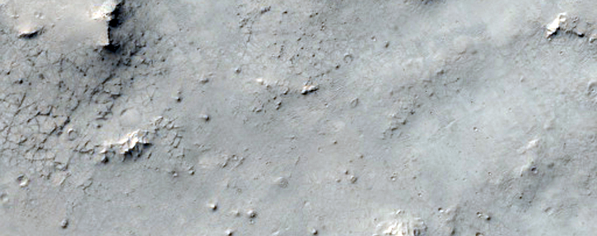Possible Iron-Magnesium Phyllosilicate Exposure Adjacent to Crater
