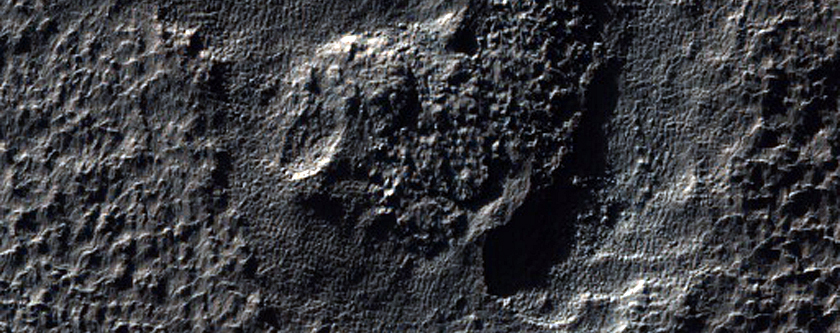 Possible Hydrated Mineralogy on Eudoxus Crater Rim