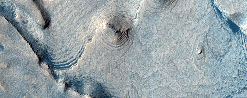 Becquerel Crater Deposits with Layered Hydrated Minerals