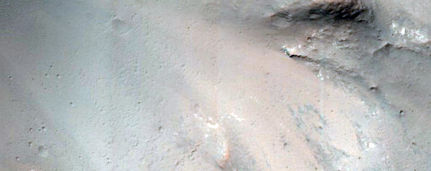 Central Pitted Uplift of a Large Impact Crater