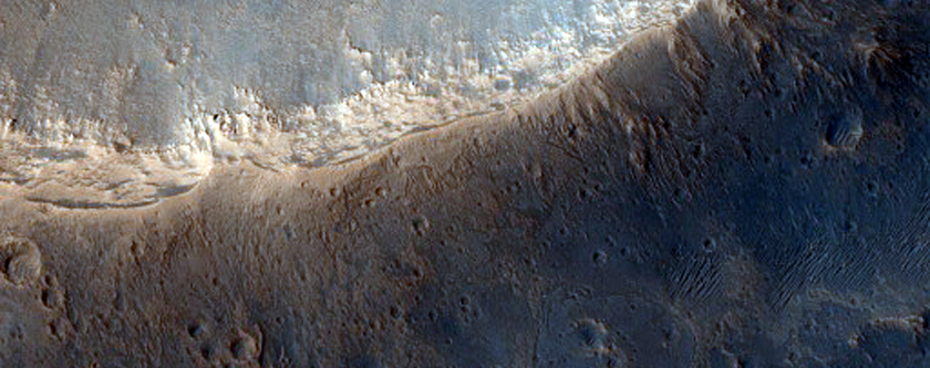 Crater with Chutes Cutting Wall-Mantling Material