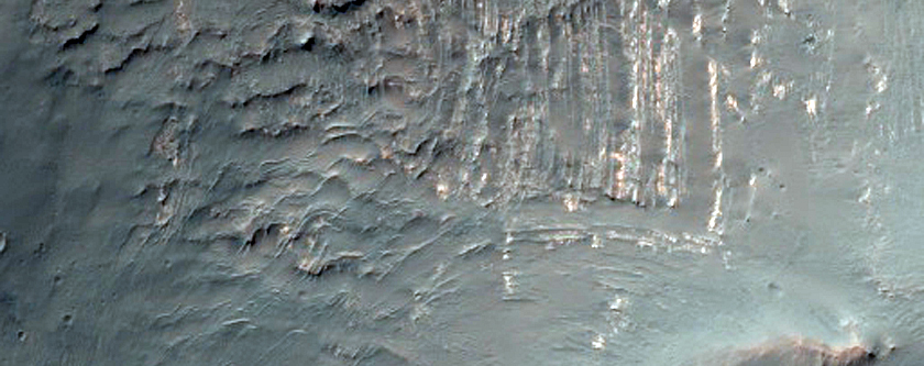 Intact Layered Rocks Uplifted in Unnamed Crater near Solis Dorsa