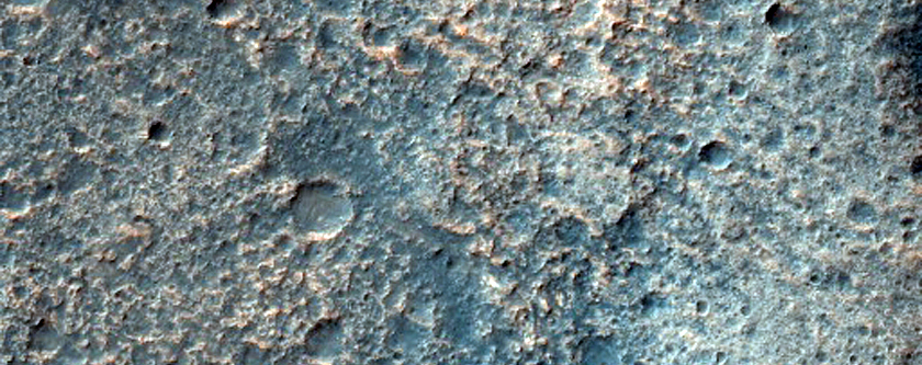 Stepped Mesas and Pits on Crater Floor with Olivine-Rich Bedrock